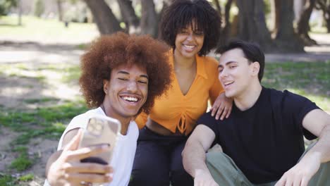 cheerful diverse friends taking selfie