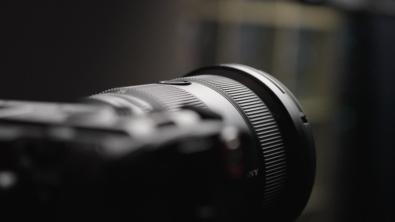 Close-up view of the lens cap being removed from the Sony FX3