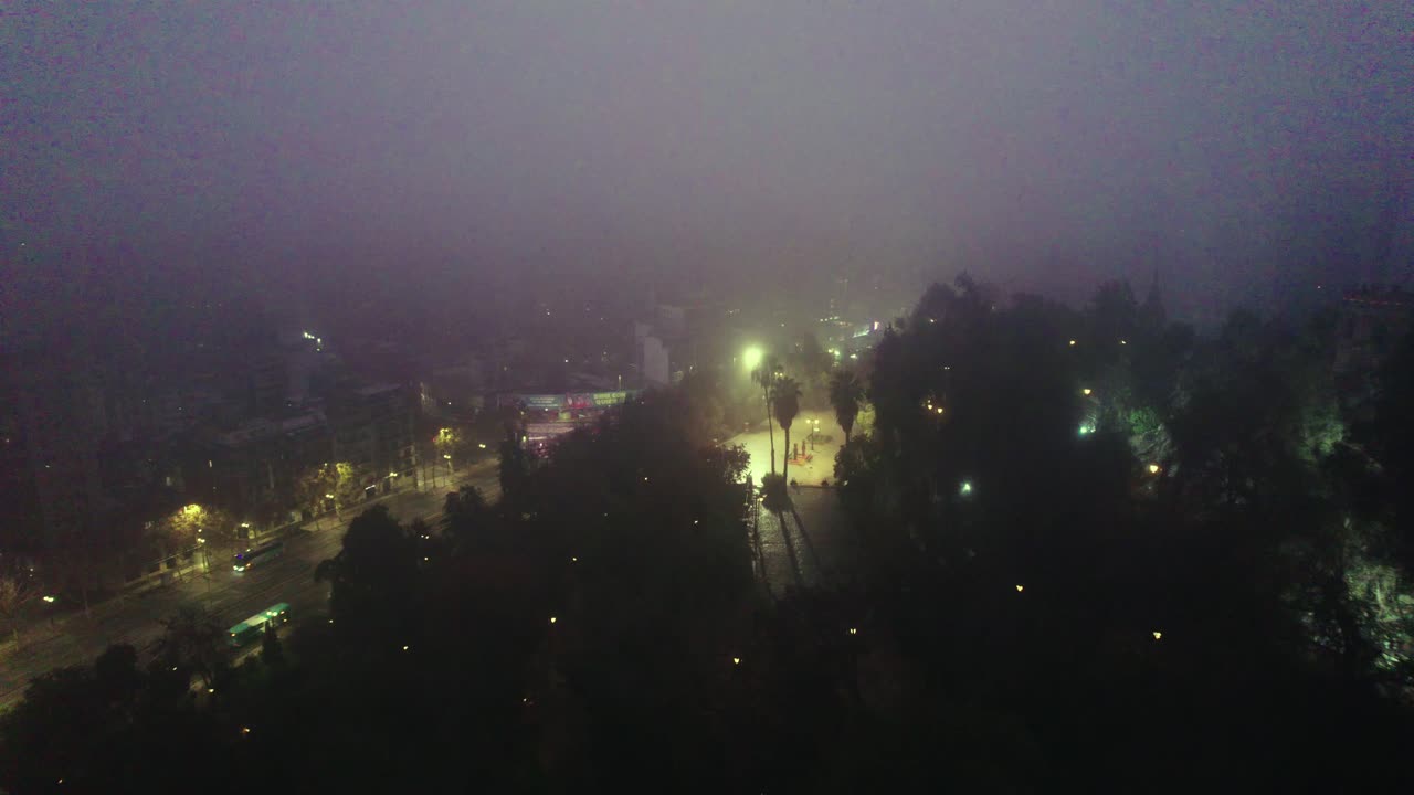 Night aerial view over the Caupolican terrace on Santa Luc&iacute;a Hill, a mysterious and lonely view on a foggy morning, low traffic
