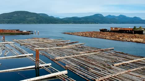 Log-booms-with-mountains-in-background