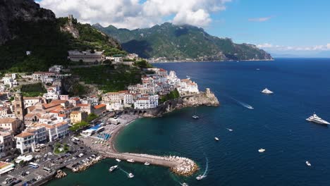 forward drone shot above iconic amalfi coast italy on summer day