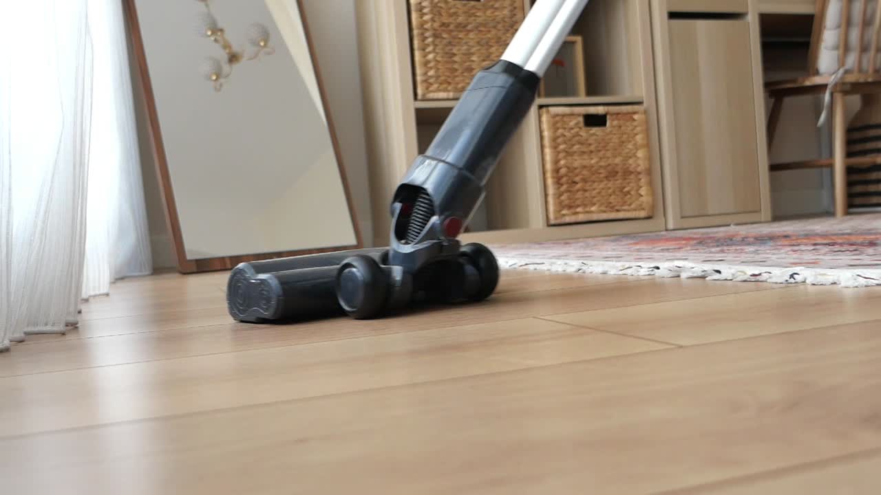 Vacuuming a hardwood floor indoors