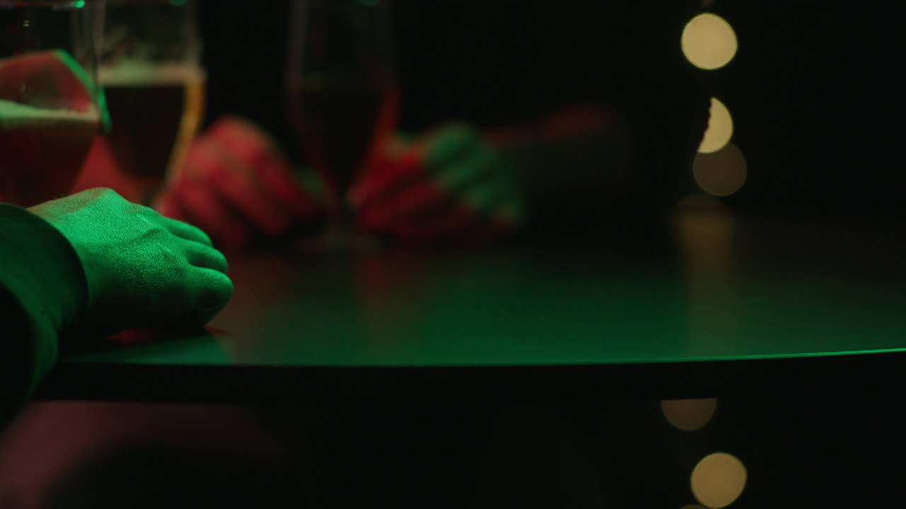Nighttime bar scene with people and drinks