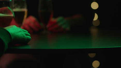 nighttime bar scene with people and drinks