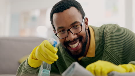 Black-man,-spray-bottle-and-cleaning-table