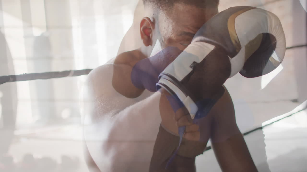 Preparing for match, boxer wearing gloves with determined focus in ring
