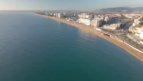 video aereo de blanes girona drone, playa mediterranea sin gente agua cristalina turquesa ciudad de costa brava turismo europeo
