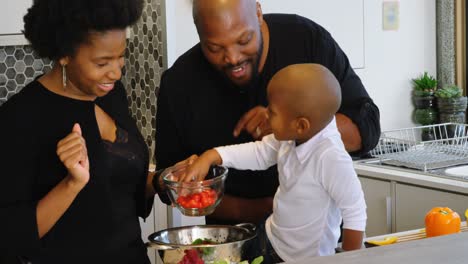 family preparing food in kitchen at home 4k