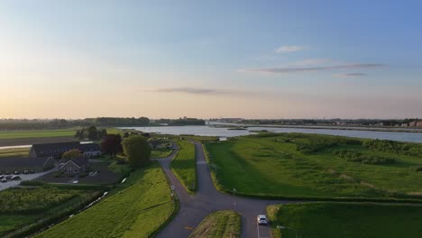 Toma-Aérea-Ascendente-Desde-El-Estacionamiento-Para-Revelar-La-Reserva-Natural-Inundada-De-Crezeepolder-En-Ridderkerk-En-Países-Bajos