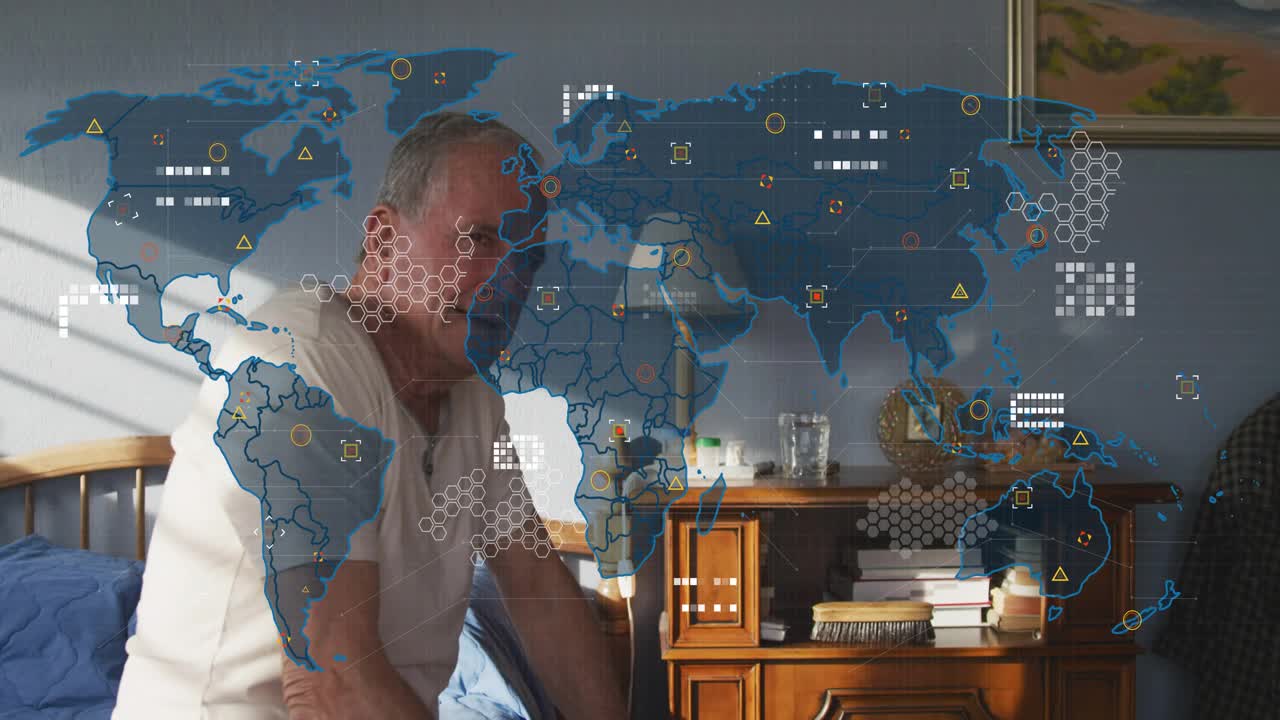 Senior man sitting on bed watching translucent world map overlay fading in exploring tech network
