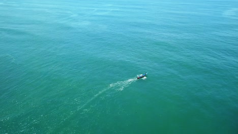 Aerial-view-of-a-traditional-fisherman-boat-cruising-on-sea---Indonesian-traditional-fishermen