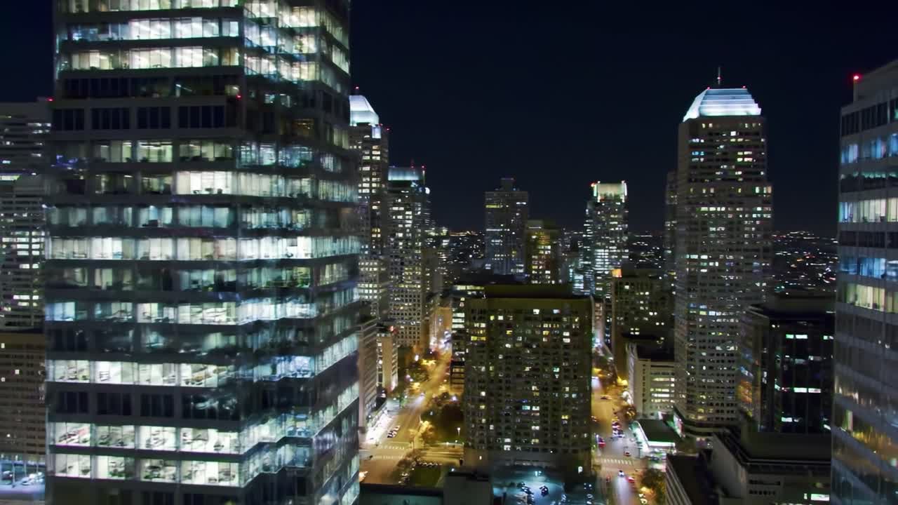Nighttime Cityscape: A Panoramic View of Dazzling Skyscrapers Illuminated by Urban Lights, Showcasing the Vibrant Nightlife and Architecture of a Modern Metropolis