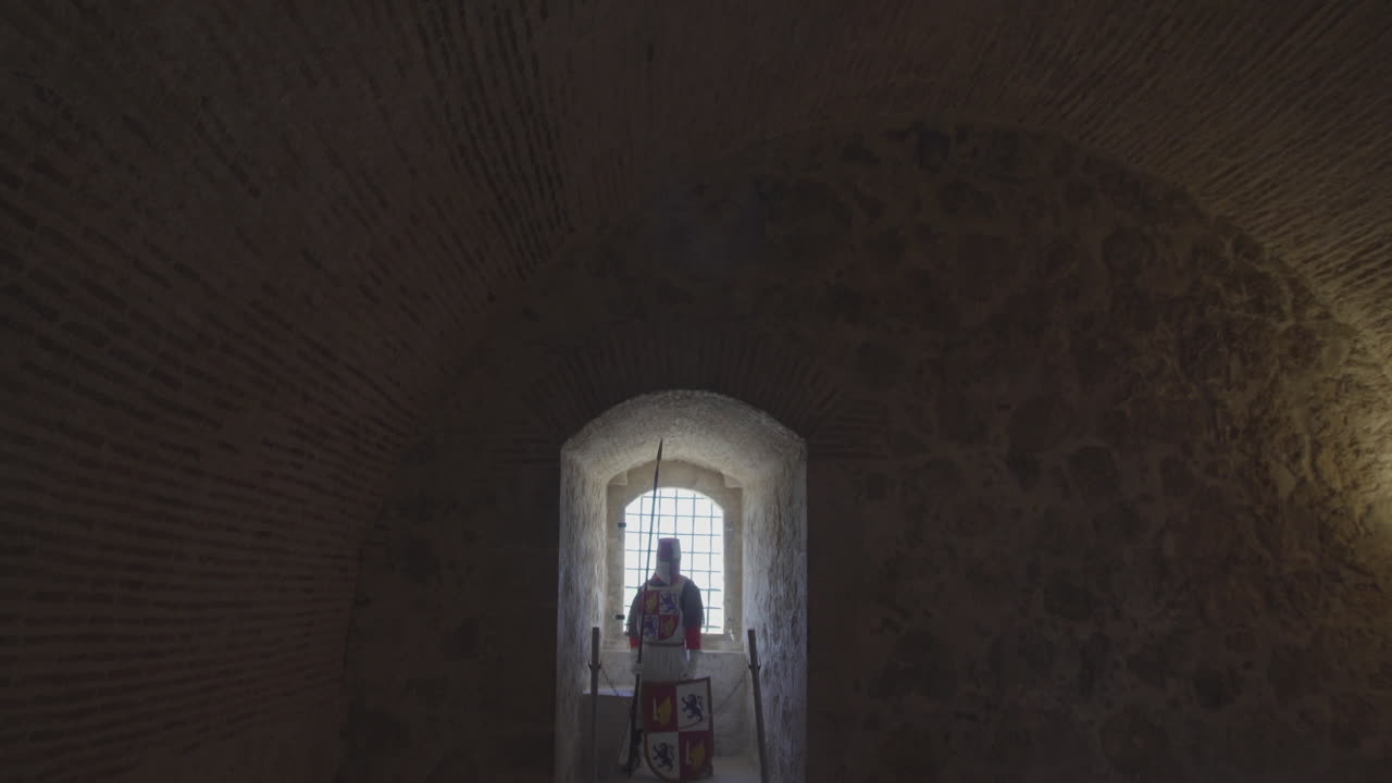A panning view of a cuirass is a piece of armor formed of pieces of metal in a Castle, Spain