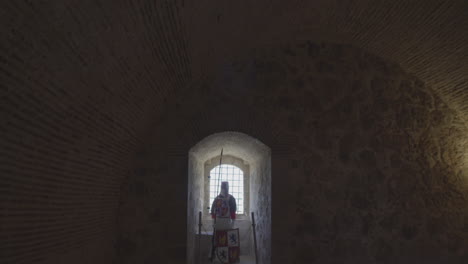 a panning view of a cuirass is a piece of armor formed of pieces of metal in a castle, spain