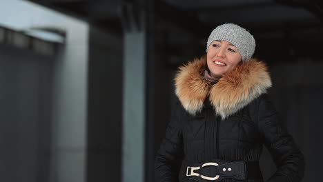 woman in winter clothes wearing a wool cap outdoor