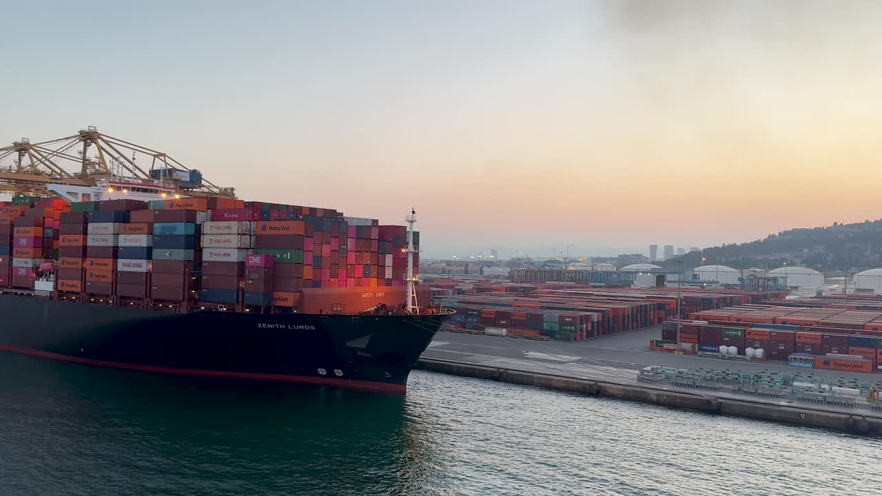 Gigantes Escobar with containers in the port of Barcelona, moored at sunset