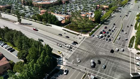 busy intersection with cars going through green light