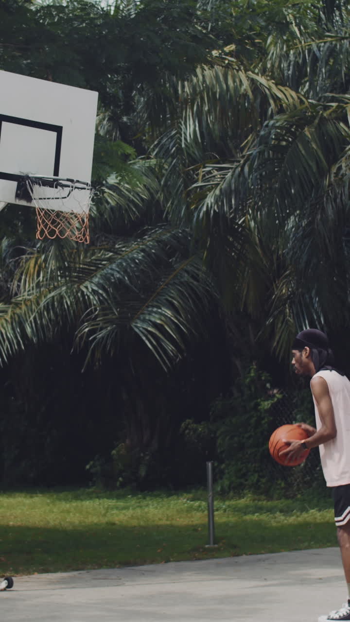 Basketballer Having Training on Outdoor Court