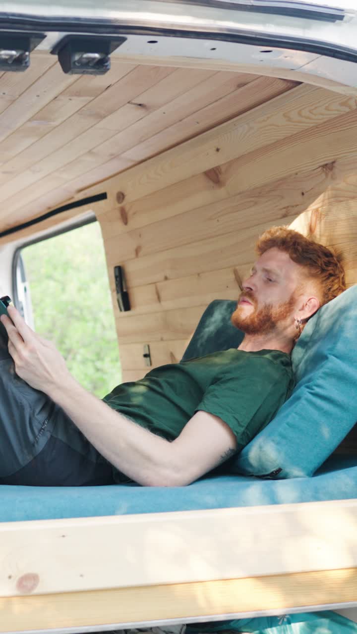 Man relaxing in a van