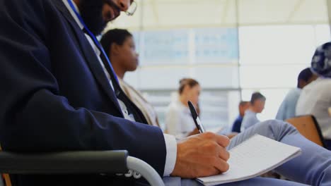 Mixed-race-businessman-attending-a-business-seminar-4k