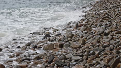 ocean waves crashing on the rocks in bai bang beach in con dao island in vietnam