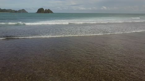 a remote surf beach at pantai selong belanak, lombok, aerial shots during day light