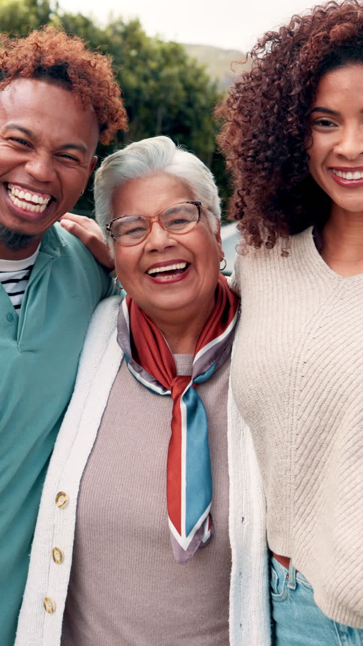 Happy Multi-Generational Family Laughing and Smiling Together Outdoors