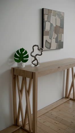 contemporary interior with abstract art and console table