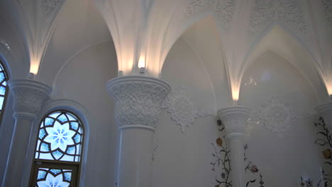 ornate white interior with stained glass windows