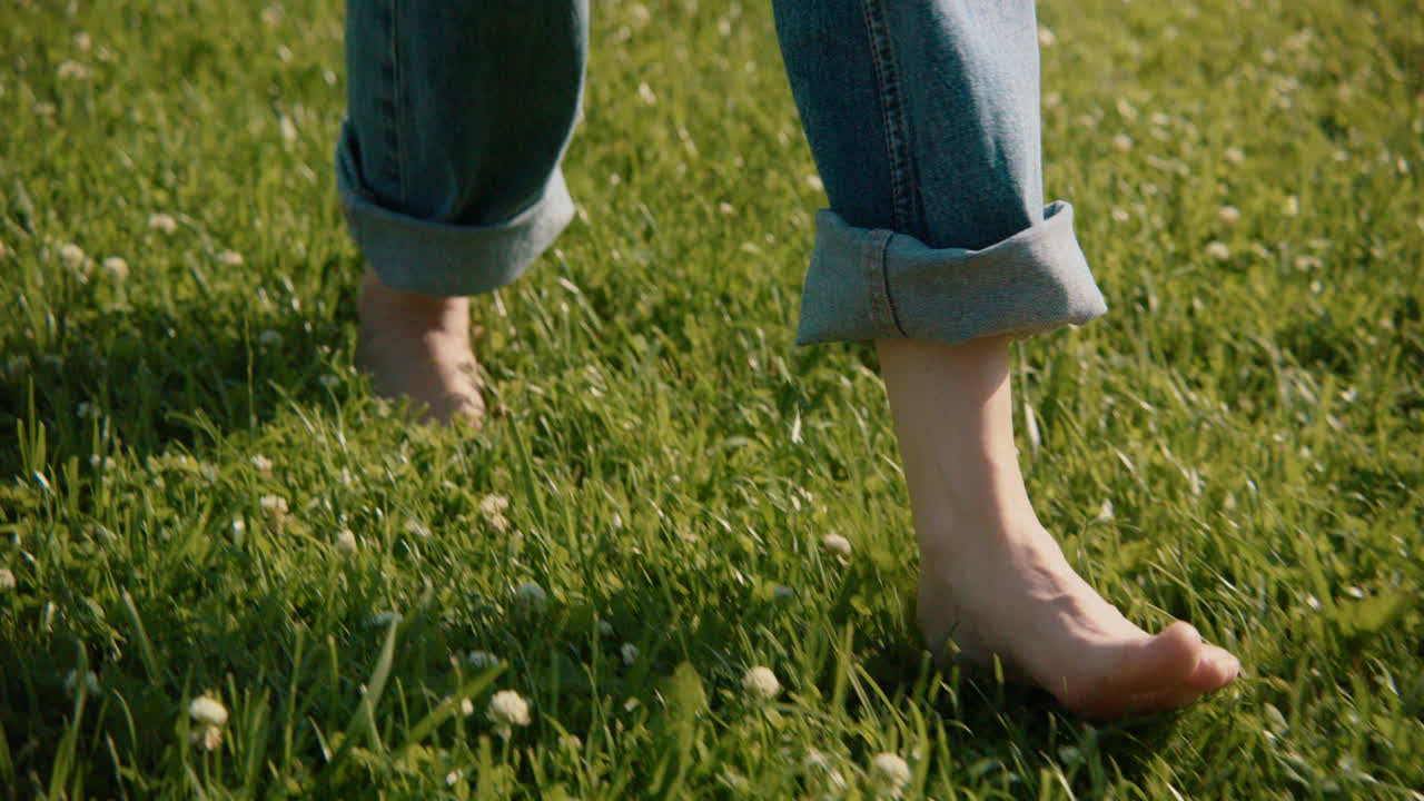 Barefoot walk in a grassy field