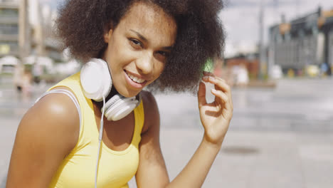 Model-in-headphones-at-street-
