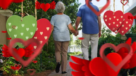 elder couple holding hands while walking for valentine day