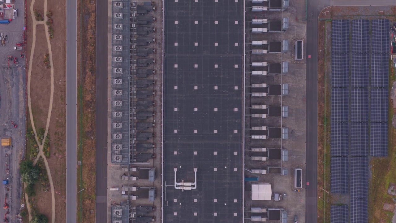 Aerial View of Industrial Data Center Facility with Solar Panels