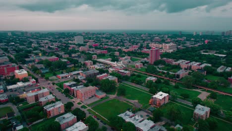 orbiting moody atmospheric aerial of south side chicago with view of downtown
