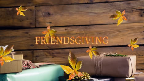 animation of friendsgiving text over autumn leaves and gifts on wooden boards