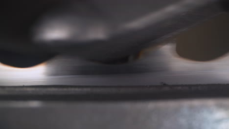 band saw blade moves through sharpening machine tool