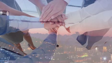 animation of diverse businesspeople clapping hands over cityscape