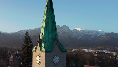 close up of clock tower of holy family church in krupowki, zakopane, poland