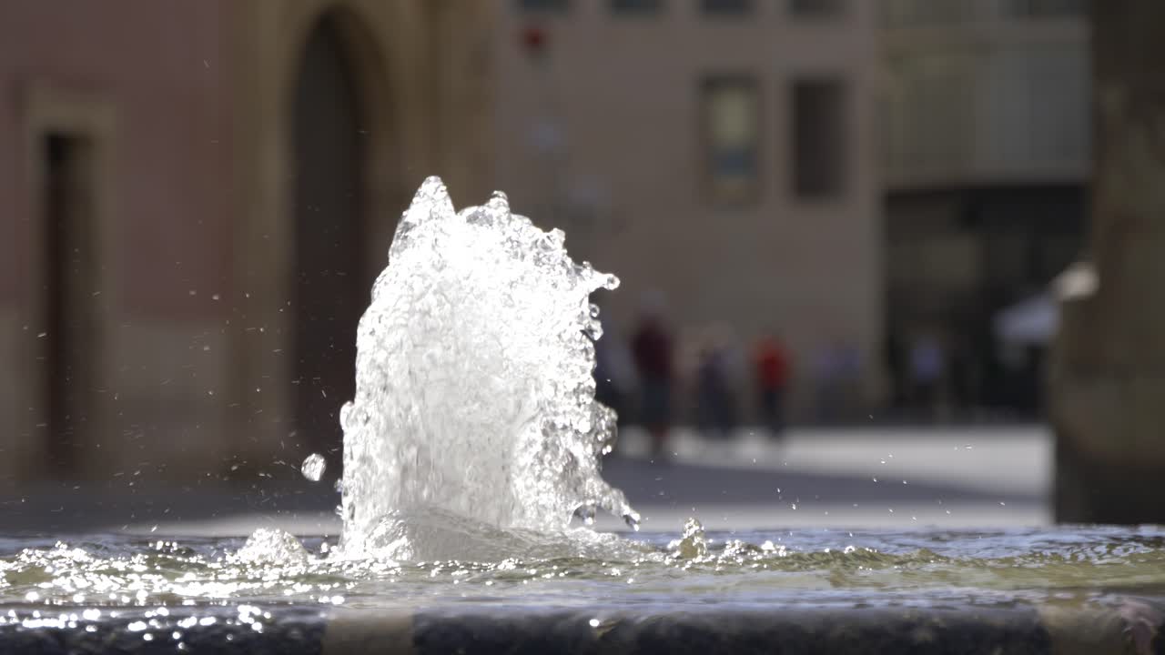 Slow motion water founting in the middle of a city in Spain