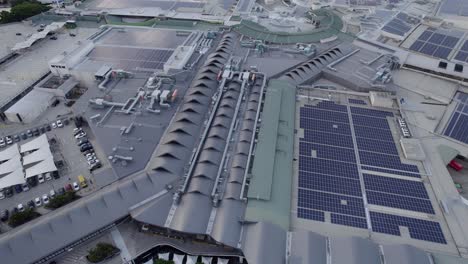 Modern-Buildings-Of-Robina-Town-Centre-With-Installed-Solar-Systems-On-The-Rooftops-In-Queensland,-Australia