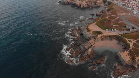 Static-drone-shot-of-the-coast-in-Porto-Covo,-Portugal