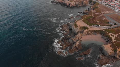 static drone shot of the coast in porto covo, portugal