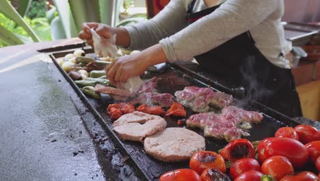 person prepares mexican food on the grill