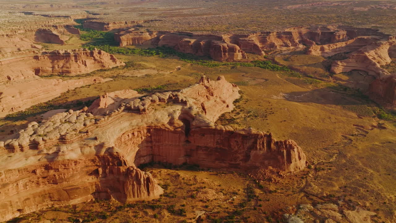 Arches canyons in Utah, USA. Amazing landscape of huge rocks in the rays of bright sun. Aerial view.
