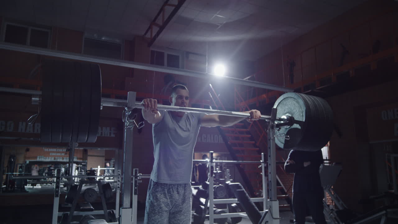 Man Performing Weightlifting Exercises in Gym | freepik
