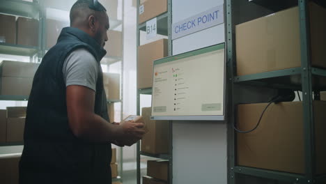 warehouse worker scanning packages