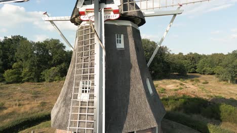 dutch windmill in a forest landscape