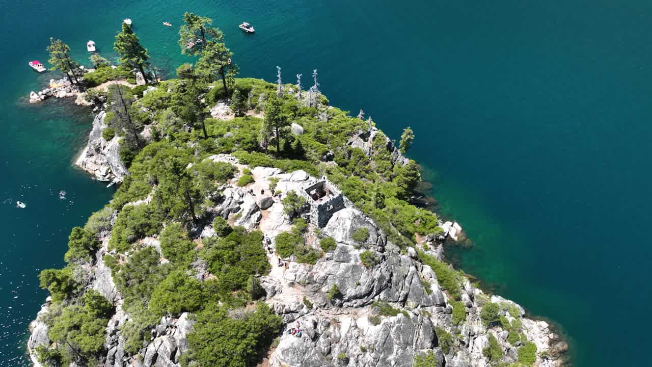 High angle drone shot around the Tea House on Fannette Island in Tahoe, USA
