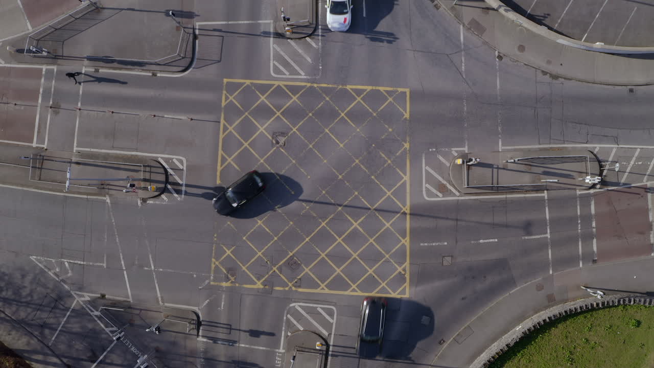 Aerial top down of a 4 way junction on a sunny day