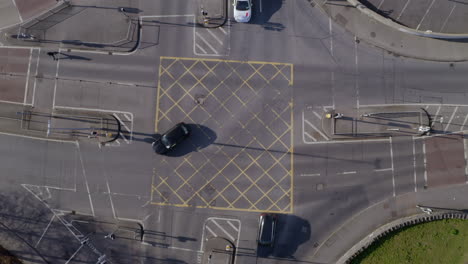 aerial top down of a 4 way junction on a sunny day